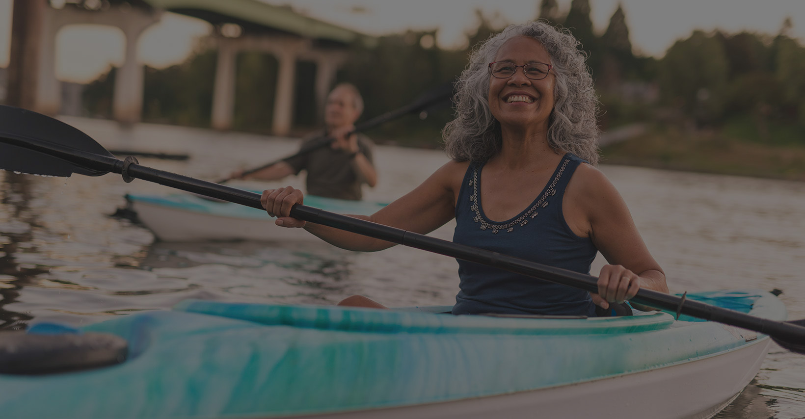 Woman smiling while kayaking
