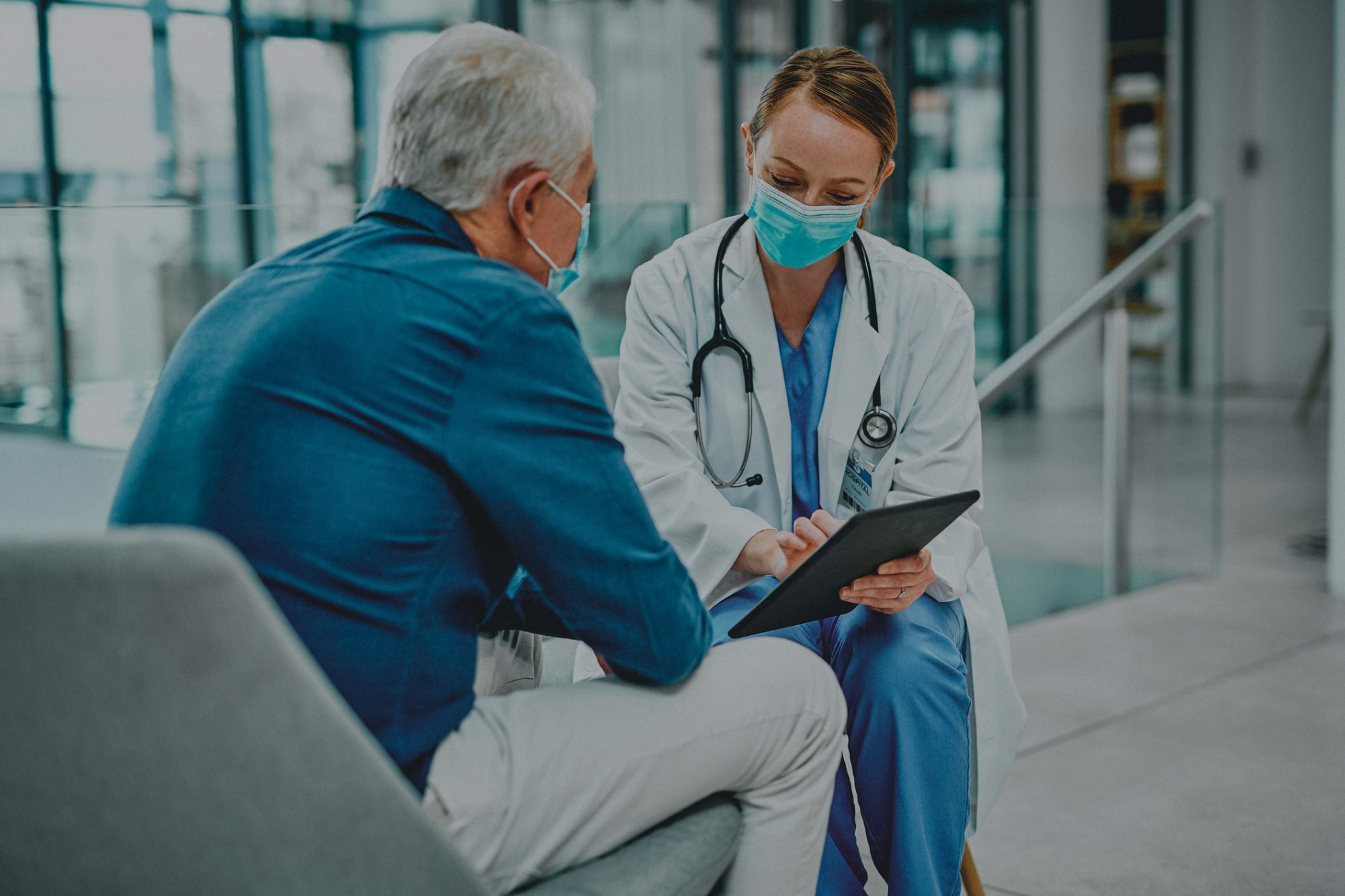 Physician talking with an older patient